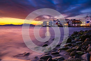 Mykonos, Greece. View of a traditional house in Mykonos. The area of Little Venice. Seascape during sunset. Sea shore and beach