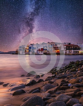 Mykonos, Greece. View of a traditional house in Mykonos. The area of Little Venice. Milky way. Sea shore and beach.