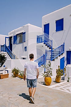 Mykonos Greece, Young man at the Streets of old town Mikonos during vacation in Greece, Little Venice Mykonos Greece
