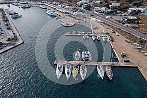 Mykonos island marina, aerial drone view. Sailboats and yachts anchored at port dock. Greece, Cyclades