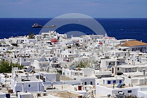 Mykonos touristic destination with traditional whitewashed houses in Greece with blue Mediterranean sea