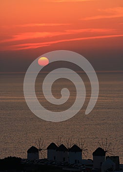 MYkonos windmills under sunset