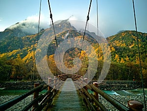 Myojin bridge and Azusa river in late autumn at Kamikochi National Park, Matsumoto, Nagano, Japan