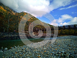 Myojin bridge and Azusa river in late autumn at Kamikochi National Park, Matsumoto, Nagano, Japan