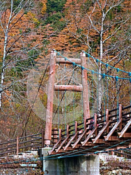 Myojin bridge and Azusa river in late autumn at Kamikochi National Park, Matsumoto, Nagano, Japan