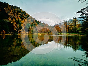 Myojin pond at Hotaka Rear shrine in Kamikochi, Nagano, Japan