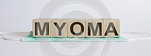 MYOMA medicine words on the wooden block.Healthcare conceptual for hospital, clinic and medical business