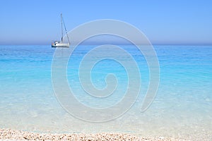 Myrthos Beach, crystal clear waters and the ship with sails