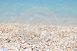 The Myrthos beach with little white stones and crystal clear waters blue