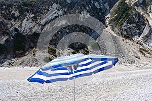 The Myrthos beach with little white stones and the rocks