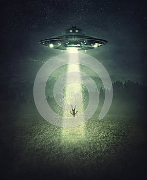 Mysterious alien spaceship abduction scene. Surreal concept with a levitating human stolen by the light of an UFO ship in a dark