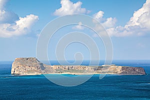 Mysterious Balos bay, island Crete, Greece. In the azure sea there are mountains edged with the water. Sky with clouds. Waves.