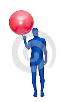 Mysterious blue man in morphsuit exercise with pilates ball