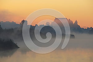 Mysterious Castle In Foggy Autumn