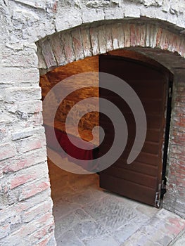 Mysterious door, secret entrance with warm light inside