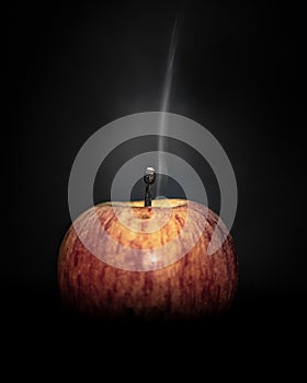 Mysterious, eerie plume of smoke rises from a diminutive apple photo