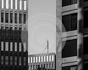 Mysterious and enigmatic modern office and court buildings in the sunset of the city of justice with light and shadow.