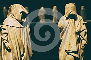 Mysterious friar monks white marble statues.