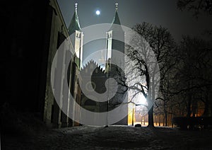 Mysterious gothic cathedral in Plock Poland at night by the moonlight. Cathedral of the Blessed Virgin Mary of Masovia, in Plock. photo