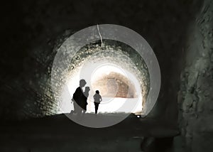 Mysterious image of ghostlike children in an obscure cave.