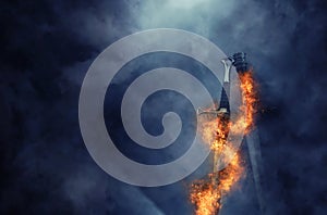 Mysterious and magical photo of silver sword with fire flames over Gothic black background. Medieval period concept