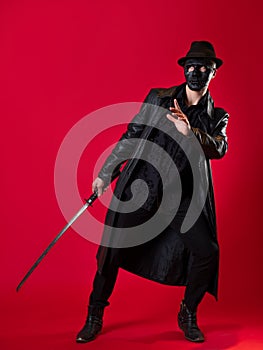 A mysterious ninja assassin in a noir style. A man in black leather clothes