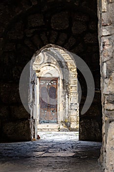 Mysterious old stone archway leading to the entrance of the Motsameta monastery in Imereti, Georgia