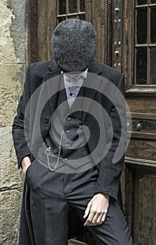 Mysterious portrait of retro 1920s english gangster with flat cap.