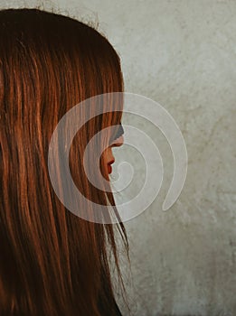 Mysterious red-haired girl in a mask