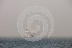 Mysterious sailing ship surrounded fog photo