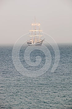 Mysterious sailing ship surrounded fog photo