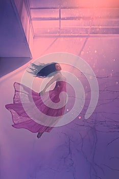 Mysterious sleeping girl with long flowing black hair, levitating beauty in long flying pink tender dress, sinking lady