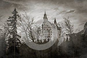 Mysterious view of Neuschwanstein Castle with fog in Bavarian alps, Germany