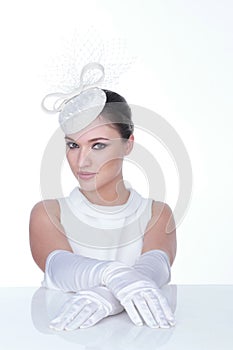 Mysterious Woman in Elegant white Hat and glowes