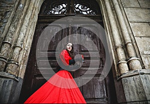 Mysterious woman in red Victorian dress