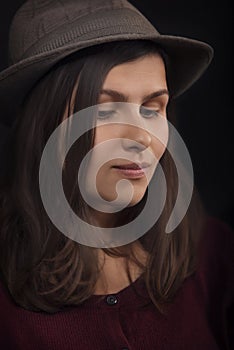 Mysterious woman in retro hat, close up portrait
