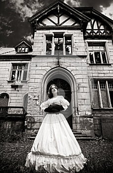 Mysterious woman in a white Victorian dress