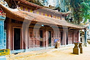 Mysterious wooden buddhist temple Bich pagoda complex under cave, Tam Coc, Ninh Binh, Vietnam