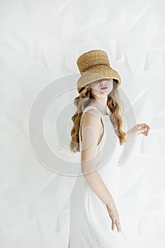 Mysterious Young Woman in Straw Hat