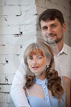 Mysteriously smiling girl with husband