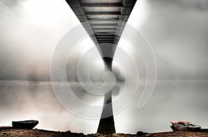 Mystery bridge with two boats photo