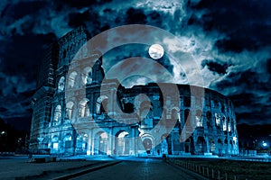 Mystery creepy view of Colosseum Coliseum at night, Rome, Italy