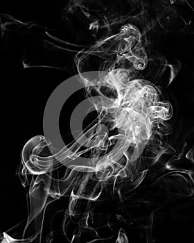 Mystery dense smoke over black background, abstract photo
