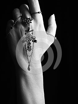 Mystic black & white female hand with gothic chain