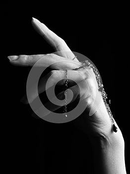 Mystic black & white female hand with gothic chain