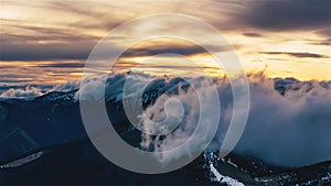 Mystic clouds sky motion fast over alps mountains nature in spring evening at golden sunset Time lapse