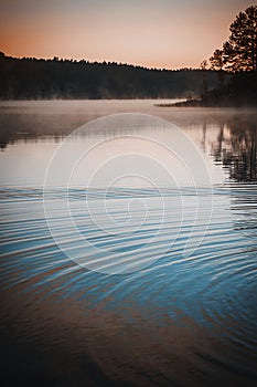 Mystic fog and circles on the water surface.