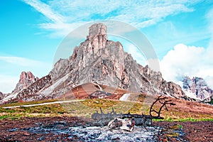 Mystic  magical fantastic autumn landscape with ash near a burned tree mountain on Passo Giau near S. Lucia in the Dolomites in