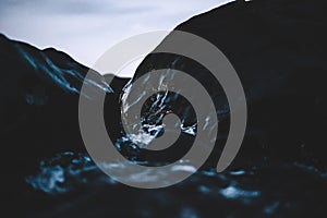 Mystic photo of water running over rocks. Rocks framing the photo