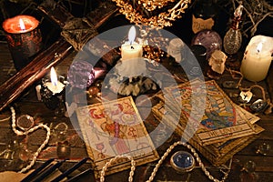 Mystic ritual with tarot cards, magic objects and candles